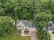 Beautiful home with lush surroundings, mature trees, and meticulously maintained landscaping creating a private and serene atmosphere at 7808 Sandy Bottom Way, Raleigh, NC 27613