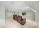 Spacious bonus room with reclining seating, a ceiling fan, and a tv at 7808 Sandy Bottom Way, Raleigh, NC 27613