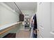 Walk-in closet with shelving, hanging rods, and ample storage space at 7808 Sandy Bottom Way, Raleigh, NC 27613
