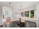 Cozy dining area adjacent to the kitchen features natural light and views of the outdoor greenery at 7808 Sandy Bottom Way, Raleigh, NC 27613
