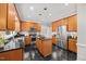 Spacious kitchen boasts stainless appliances, black granite countertops, and a functional center island at 7808 Sandy Bottom Way, Raleigh, NC 27613