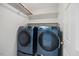 Modern laundry room features updated washer and dryer units at 7808 Sandy Bottom Way, Raleigh, NC 27613