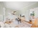Inviting living room featuring hardwood floors, neutral walls, and a large window providing ample natural light at 7808 Sandy Bottom Way, Raleigh, NC 27613