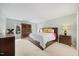 Bright main bedroom featuring neutral colors, carpet, and a large bed at 7808 Sandy Bottom Way, Raleigh, NC 27613