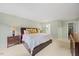 Another angle of the main bedroom offering a peek into the ensuite bathroom and closet at 7808 Sandy Bottom Way, Raleigh, NC 27613