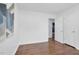 Bedroom with hardwood flooring, fresh paint, and natural light from windows at 801 Lincoln Dr, Rocky Mount, NC 27801