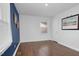 Bedroom with hardwood flooring, fresh paint, and natural light at 801 Lincoln Dr, Rocky Mount, NC 27801