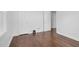 Bedroom with hardwood flooring, fresh paint, natural light from windows, and closet space at 801 Lincoln Dr, Rocky Mount, NC 27801