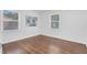 Cozy bedroom with hardwood flooring and multiple windows for ample natural light at 801 Lincoln Dr, Rocky Mount, NC 27801
