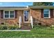 Welcoming front entrance of a brick home with a lovely landscaped garden at 801 Lincoln Dr, Rocky Mount, NC 27801