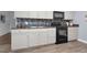 Well-lit kitchen featuring stainless steel appliances, shaker cabinets, and a stylish backsplash at 801 Lincoln Dr, Rocky Mount, NC 27801