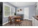 Bright kitchen with a dining area and sleek black appliances at 801 Lincoln Dr, Rocky Mount, NC 27801
