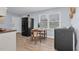 Bright kitchen with a dining area and sleek black appliances at 801 Lincoln Dr, Rocky Mount, NC 27801