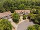 Townhomes with individual garages in a wooded, community neighborhood at 809 Davidson Point Rd, Cary, NC 27513