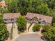 Overhead view of townhomes with garages nestled in a leafy neighborhood at 809 Davidson Point Rd, Cary, NC 27513