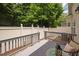 Back deck of home with fenced in yard and trees in background at 809 Davidson Point Rd, Cary, NC 27513