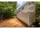 View of the spacious, fenced backyard from the side of the home at 809 Davidson Point Rd, Cary, NC 27513