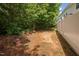 View of the backyard with perimeter fence and surrounding trees at 809 Davidson Point Rd, Cary, NC 27513
