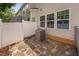 Backyard patio with stone pavers and fenced perimeter at 809 Davidson Point Rd, Cary, NC 27513