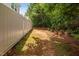 Spacious fenced backyard with potential for gardening or recreation at 809 Davidson Point Rd, Cary, NC 27513