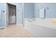 Bathtub with ceramic tile and glass enclosed shower at 809 Davidson Point Rd, Cary, NC 27513