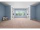 Spacious bedroom with neutral carpet, and built-in shelving at 809 Davidson Point Rd, Cary, NC 27513
