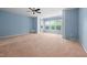 Large bedroom with bright blue walls and large windows at 809 Davidson Point Rd, Cary, NC 27513