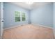 Bright bedroom with neutral walls, natural light from windows, plush carpeting and spacious design at 809 Davidson Point Rd, Cary, NC 27513