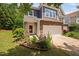 Well maintained townhouse with stone accents, a private entry, and garden bed at 809 Davidson Point Rd, Cary, NC 27513