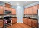Well-equipped kitchen with stainless steel appliances and granite countertops at 809 Davidson Point Rd, Cary, NC 27513