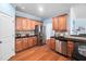 Traditional kitchen featuring granite countertops, stainless steel appliances, and classic wood cabinets at 809 Davidson Point Rd, Cary, NC 27513