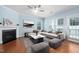 Bright living room featuring hardwood floors, a fireplace, and stylish virtual staging at 809 Davidson Point Rd, Cary, NC 27513