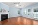 Bright living room featuring hardwood floors, a fireplace, and plenty of natural light at 809 Davidson Point Rd, Cary, NC 27513