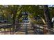 A wooden bridge spans a tranquil area in the park, lined with trees at 809 Davidson Point Rd, Cary, NC 27513