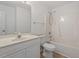 Bathroom featuring a bright vanity and shower-tub combination for essential comfort at 8326 Glenwood Springs Ct, Raleigh, NC 27616