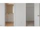 Bright bathroom with vanity and shower-tub combination plus adjacent closet space offers essential features at 8326 Glenwood Springs Ct, Raleigh, NC 27616