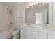 Bathroom featuring double vanity, shower-tub combination, and bright lighting offers practical comfort at 8326 Glenwood Springs Ct, Raleigh, NC 27616