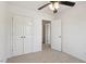 Bedroom with closet and ceiling fan; neutral walls and carpets offer a blank canvas at 8326 Glenwood Springs Ct, Raleigh, NC 27616