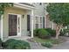 Welcoming front entrance with dark door, pristine landscaping, and prominent house number at 8326 Glenwood Springs Ct, Raleigh, NC 27616