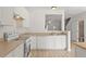 Open kitchen featuring light countertops and a view of the dining area and front entry at 8326 Glenwood Springs Ct, Raleigh, NC 27616