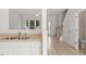 Bright kitchen featuring light countertops and an open view to the front entry at 8326 Glenwood Springs Ct, Raleigh, NC 27616