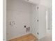 Spacious walk-in closet boasts wire shelving, electrical outlets, and laminate flooring for practical storage at 8326 Glenwood Springs Ct, Raleigh, NC 27616