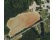 Aerial view of a large lot, marked with a red line, ready for development on Savage Rd at 8500 Savage Rd, Spring Hope, NC 27882