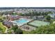 An aerial view of the neighborhood pool, tennis courts, playground and clubhouse at 948 Consortium Dr, Raleigh, NC 27603
