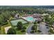 An aerial view of the neighborhood pool, tennis courts, and clubhouse at 948 Consortium Dr, Raleigh, NC 27603
