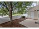 Cozy backyard with a privacy fence, mature trees and concrete patio at 948 Consortium Dr, Raleigh, NC 27603