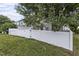 A view of the white fence and side yard at 948 Consortium Dr, Raleigh, NC 27603