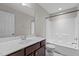 Full bathroom featuring vanity, mirror, updated hardware, and a shower-tub combo at 948 Consortium Dr, Raleigh, NC 27603