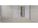 This is a carpeted secondary bedroom featuring closet, door, and neutral walls at 948 Consortium Dr, Raleigh, NC 27603