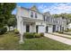 Charming townhome featuring a one-car garage and nicely landscaped front yard for curb appeal at 948 Consortium Dr, Raleigh, NC 27603